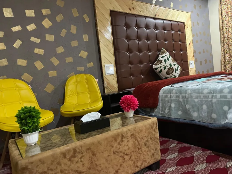 Tea table and chairs in a guest room at Hotel Seven Pahalgam
